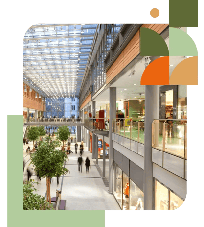 Bright modern shopping centre with glass roof, natural light, and indoor greenery — representing Air Theory’s commercial mechanical services that deliver approval-ready, scope-tight systems for developers, builders, and tenants Bright modern shopping centre with glass roof, natural light, and indoor greenery — representing Air Theory’s commercial mechanical services that deliver approval-ready, scope-tight systems for developers, builders, and tenants